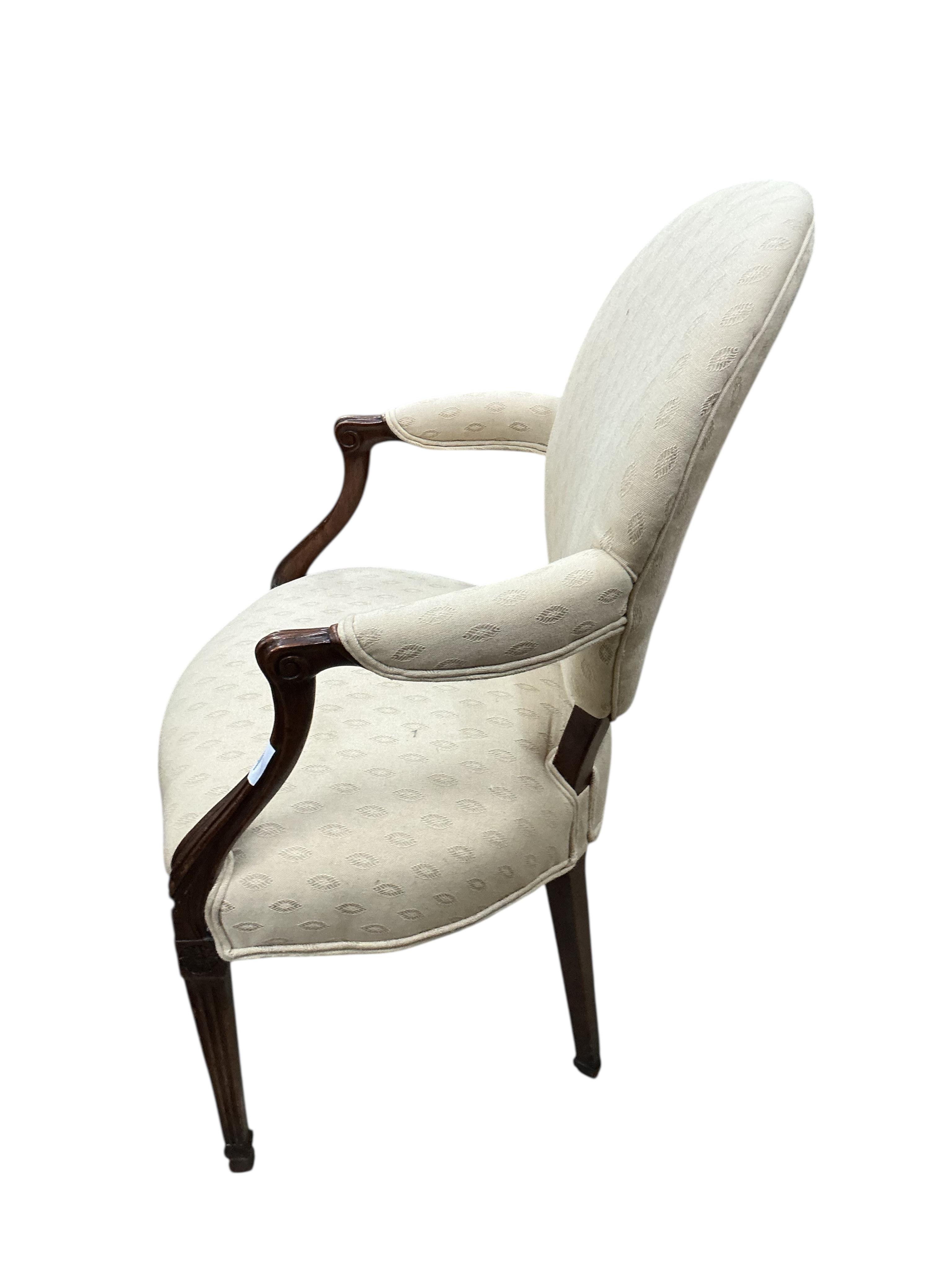 A George III Hepplewhite style upholstered mahogany elbow chair, width 61cm, depth 44cm, height 94cm